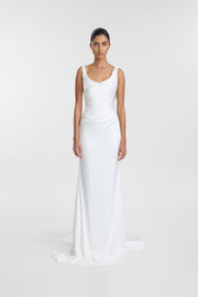 A model wearing an ivory satin wedding gown with a scoop neckline, draped bodice and fit-and-flare skirt, photographed against a seamless light grey studio background.